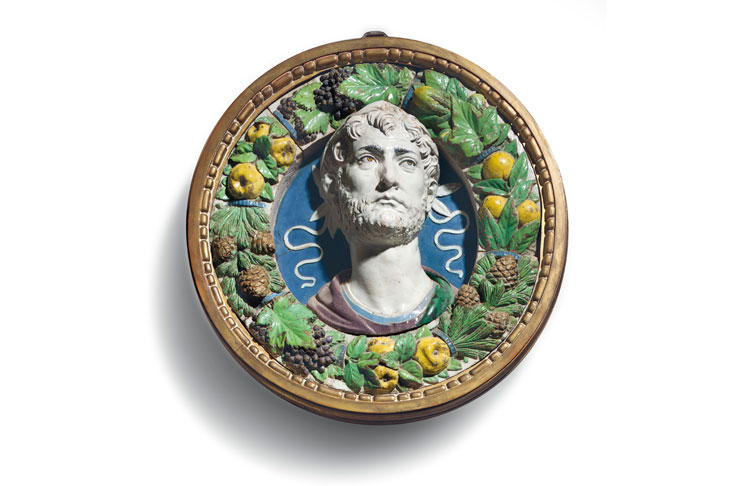 A polychrome glazed terracotta bust of a laureate in a frame of fruit, vegetables and pine cones (c. 1487–94), Andrea della Robbia