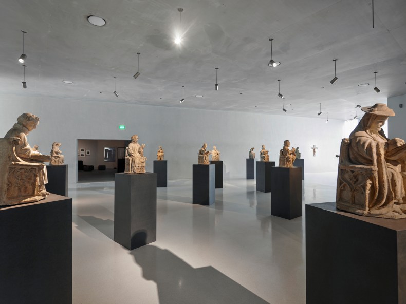 14th-century stone figures from the archivolt of the St Peter Portal, Cologne Cathedral, displayed in a gallery at Kolumba