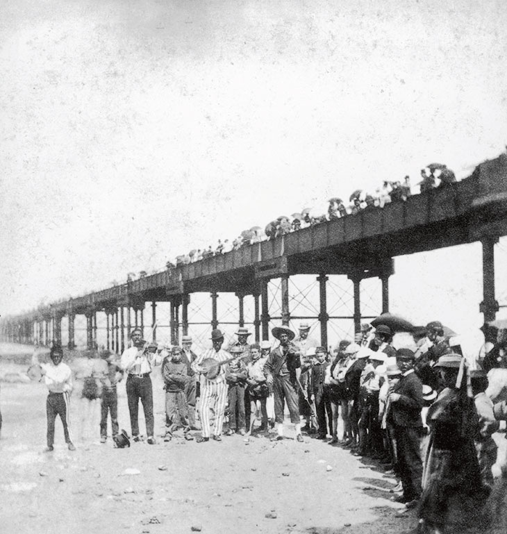 A musical troupe entertaining holidaymakers