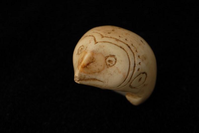 An ivory toggle in the form of an owl, from a burial at Nuvuk, Alaska, AD 875–1080