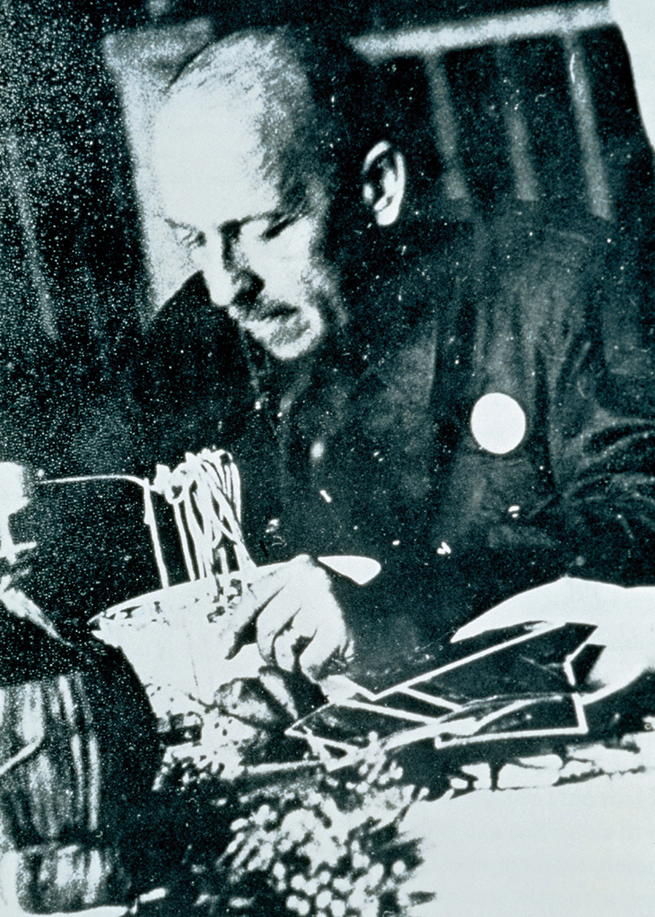 Filippo Tommaso Marinetti eating pasta at Biffi, a restaurant in Milan in 1930. The Estorick Collection, London