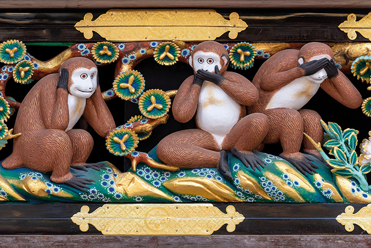 Carved monkeys in a panel on the facade of the sacred horse stable at Nikko (photo: 2019).