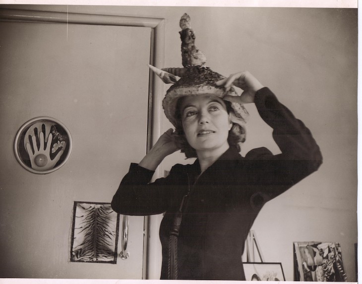 Eileen Agar wearing her Ceremonial Hat for Eating Bouillabaisse in 1936.