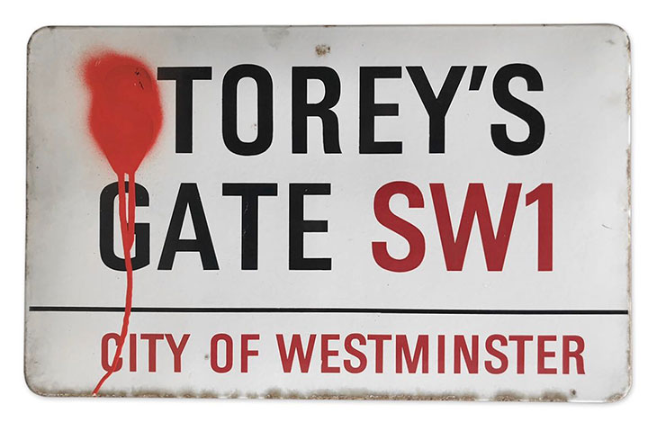 An enamelled iron street sign for Storey’s Gate (estimate £60–£100)