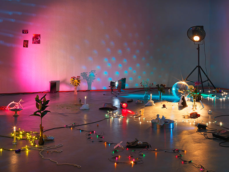 An installation of colourful lights and a disco ball
