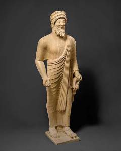 Limestone statue of a bearded man with votive offerings. Cypriot, (c. 475–450 BC)