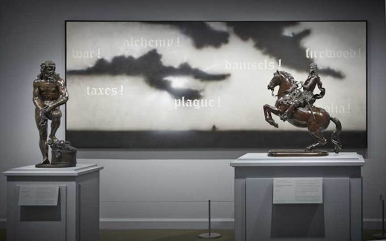 Installation view at the Frick Collection showing Adriaen de Vries’s 'Bacchic Man Wearing a Grotesque Mask' and Giuseppe Piamontini’s 'Prince Ferdinando di Cosimo III on Horseback' with Ed Ruscha’s 'Seventeenth Century' © Ed Ruscha.