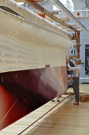 Alison Watt, cutting the 'Butterfly' tapestry from the loom. Dovecot Studios, 19 May 2014.