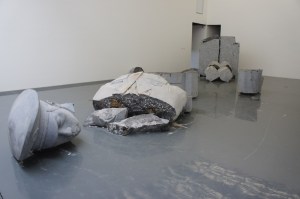 Installation view showing the broken sculpture of an officer by Zhao Zhao (b. 1982), Chambers Fine Art, 2011