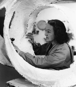 Barbara Hepworth at work on the plaster for Oval Form (Trezion) in the Palais de Danse studio, St Ives (1963)