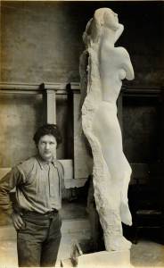 Photograph of Jacob Epstein in studio with plaster model of ‘Dancing Girl’; commission for the British Medical Association Building, Strand and Agar Street, London (c. 1907)