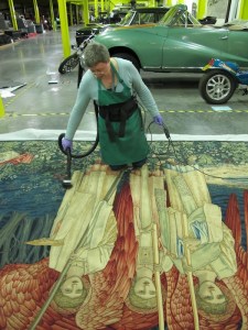 Conservator Jane Thompson-Webb prepares a panel from William Morris' Quest for the Holy Grail Tapestries (1895–1900).