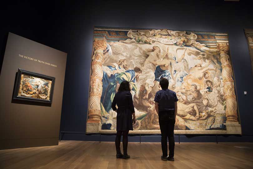 Installation view of 'Spectacular Rubens: The Triumph of the Eucharist', with 'The Victory of Truth over Heresy', (c. 1622–25), Peter Paul Rubens (Museo Nacional del Prado, Madrid), and 'The Triumph of Truth over Heresy' (1626–33), woven by Jan Raes I, Jacob Geubels II, and Jacob Fobert after designs by Peter Paul Rubens (Tapestry © Patrimonio Nacional, Monasterio de las Descalzas Reales, Madrid)