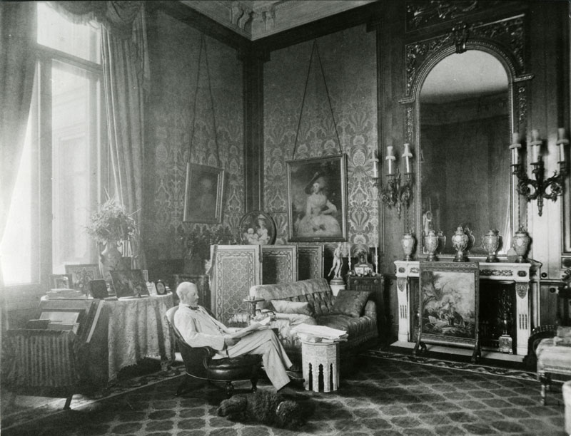 Ferdinand de Rothschild (1839–98) with the dog Poupon in The Baron's Room at Waddesdon Manor, Buckinghamshire.