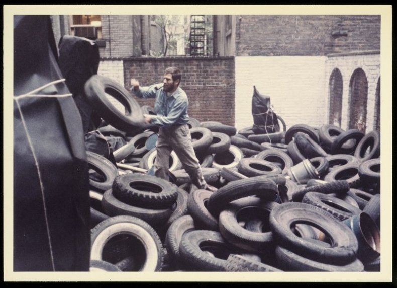 Allan Kaprow installing the first version of 'Yard', in the sculpture garden of Martha Jackson Gallery in New York, 1961.