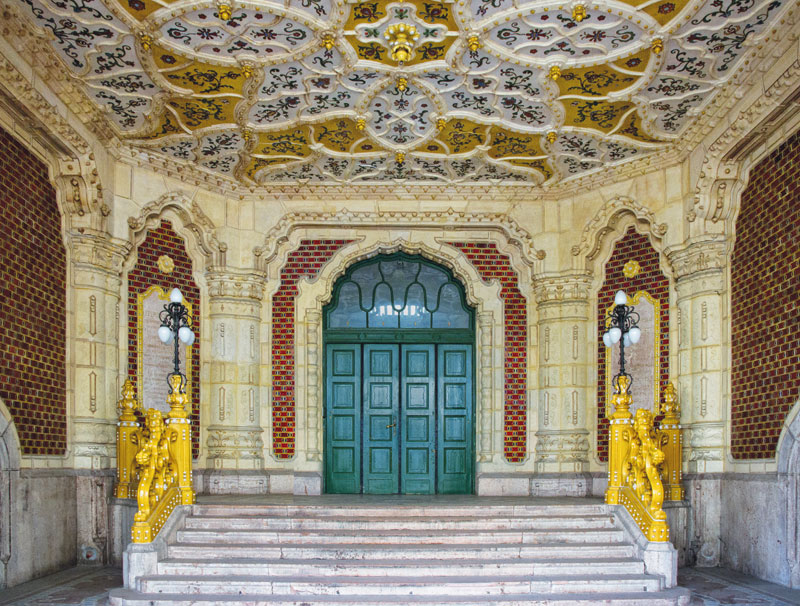 The porch at Lechner's Museum of Applied Arts, its ceiling patterned with flower motifs.