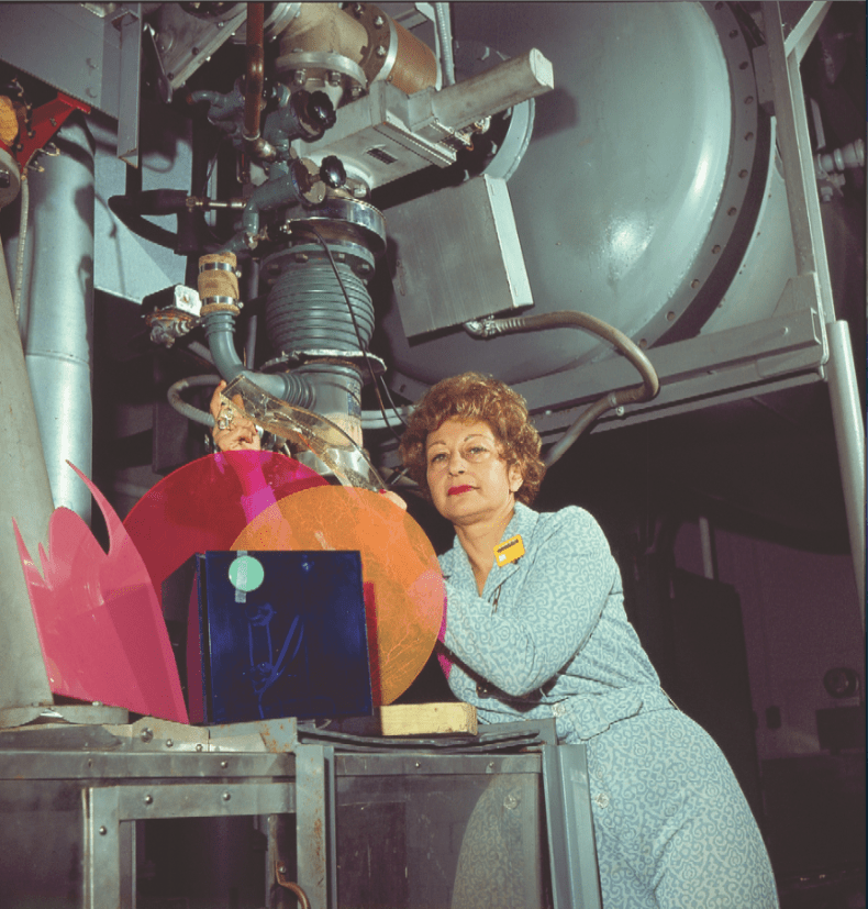 Alyce Simon (1925–2011) with particle accelarator at Radiation Dynamics, Inc. NY, 1975