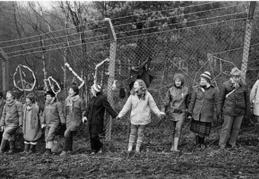 'Embrace the Base’: 30,000 women link hands, completely surrounding the nine mile perimeter fence at RAF/USAF Greenham Common, Berkshire (1982), Edward Barber.