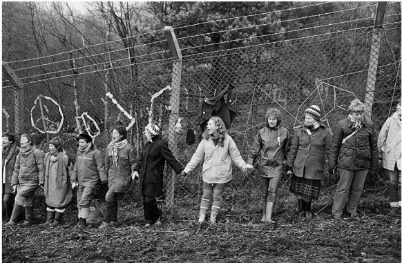 'Embrace the Base’: 30,000 women link hands, completely surrounding the nine mile perimeter fence at RAF/USAF Greenham Common, Berkshire (1982), Edward Barber.