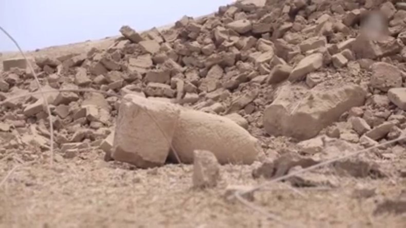 Screenshot from ISIS video showing the destroyed 'mermen' statues of the seven sages at the Fish Gate, Temple of Nabu, Nimrud, Iraq