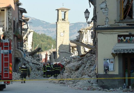 Firefighters gather near the damaged Sant'Agostino church in the central Italian village of Amatrice on 26 August, 2016, three days after a 6.2-magnitude earthquake struck the region. ANDREAS SOLARO/AFP/Getty Images
