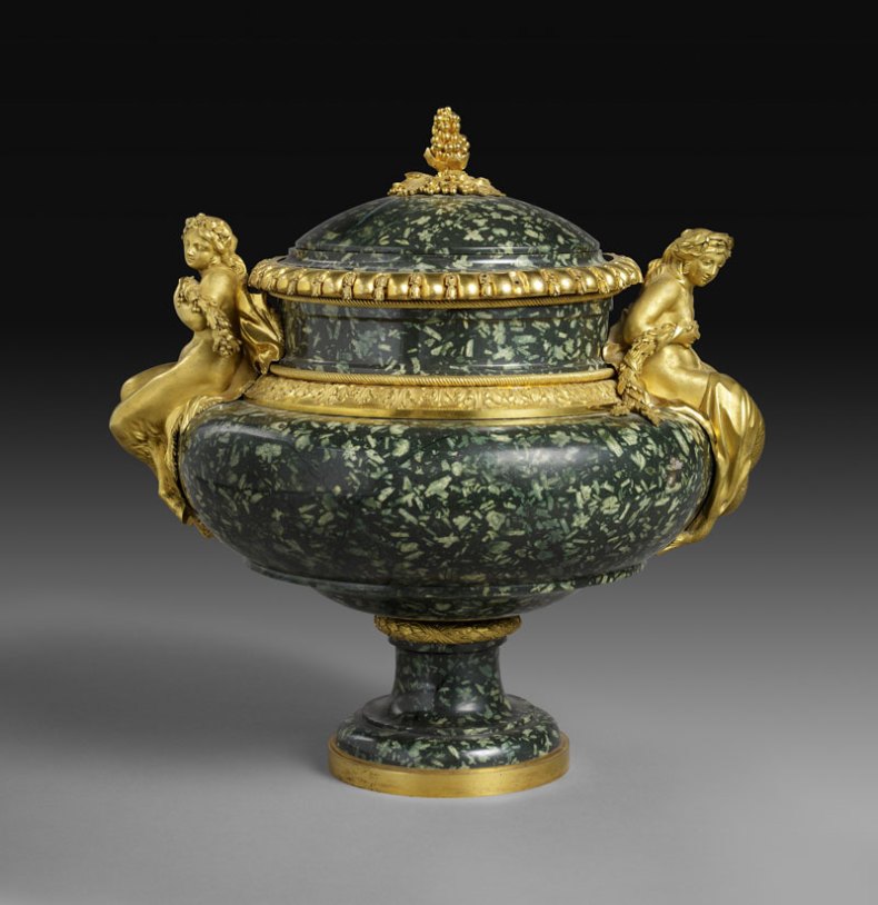 Vase (c. 1775−80), gilt bronze by Pierre Gouthière, green Greek porphyry possibly carved by Augustin Bocciardi or Pierre-Jean-Baptiste Delaplanche. After a design by François-Joseph Bélanger. Musée du Louvre, Paris; photo: RMN-Grand Palais/Art Resource, NY