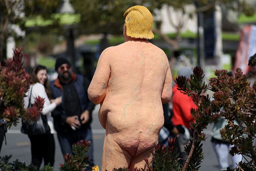 People gather around a statue depicting republican presidential nominee Donald Trump in the nude on 18 August, 2016 in San Francisco, United States. Anarchist collective INDECLINE created five statues depicting Donald Trump in the nude and placed them in five U.S. cities: San Francisco, New York, Los Angeles, Cleveland and Seattle. Justin Sullivan/Getty Images