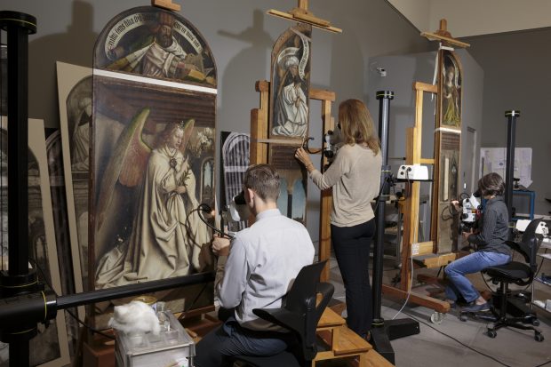 Restorers from the Royal Institute for Cultural Heritage at work on the Ghent Altarpiece ( c . 1425–32) by Hubert and Jan van Eyck in the Museum of Fine Arts Ghent.