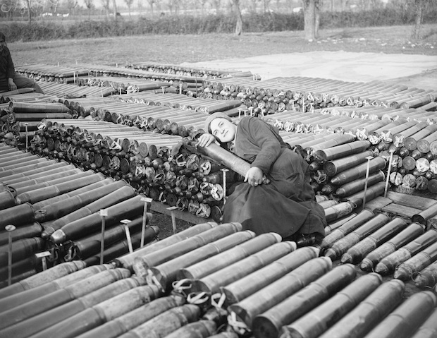 An Italian Female Worker Employed by the British Army, Lying on 18 Pounder Shells (1918), William Joseph Brunell. Courtesy: Imperial War Museum
