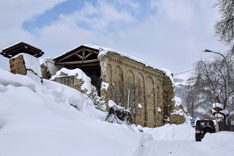 Italian military vehicles stand guard in front a Sant'Agostino church in Amatrice on January 19, 2017 after a 5.7-magnitude earthquake struck the region. The church was severely damaged in a major quake in August 2016. ANDREAS SOLARO/AFP/Getty Images