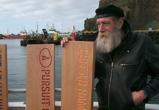 Lawrence Weiner about to leave port in Reykjavik to jettison his planks A PURSUIT OF HAPPINESS ASAP as his participation in Reykjavik Arts Festival, Iceland, 2005. © Lawrence Weiner