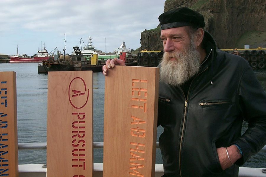 Lawrence Weiner about to leave port in Reykjavik to jettison his planks A PURSUIT OF HAPPINESS ASAP as his participation in Reykjavik Arts Festival, Iceland, 2005. © Lawrence Weiner