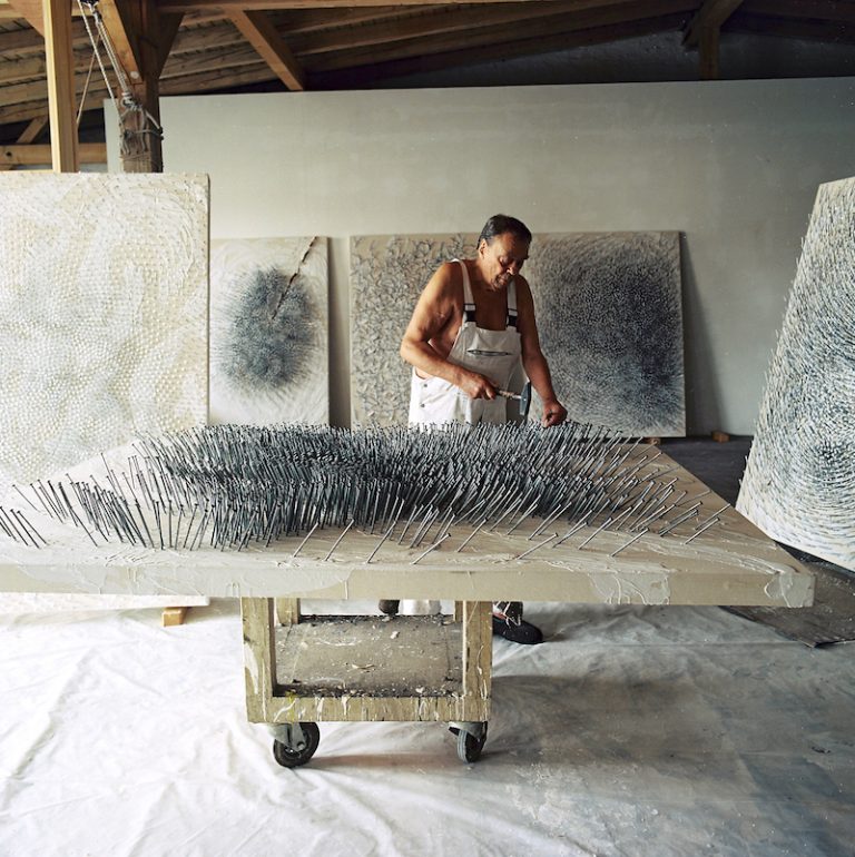 Günther Uecker working on a painting in his studio in Dusseldorf, August 2016. Photo: Herbert Koller; © 2016 Günther Uecker