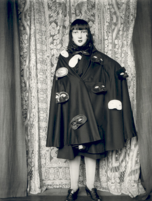 Self Portrait (full length figure in cloak and masks) (1928), Claude Cahun. © Jersey Heritage