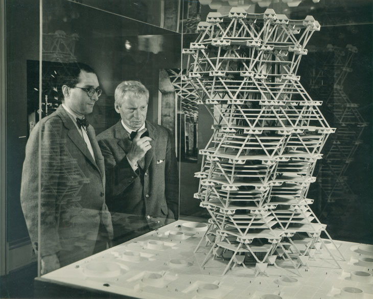Louis Kahn in front of a model of the City Tower Project in an exhibition at Cornell University, Ithaca, New York, February 1958. © Sue Ann Kahn