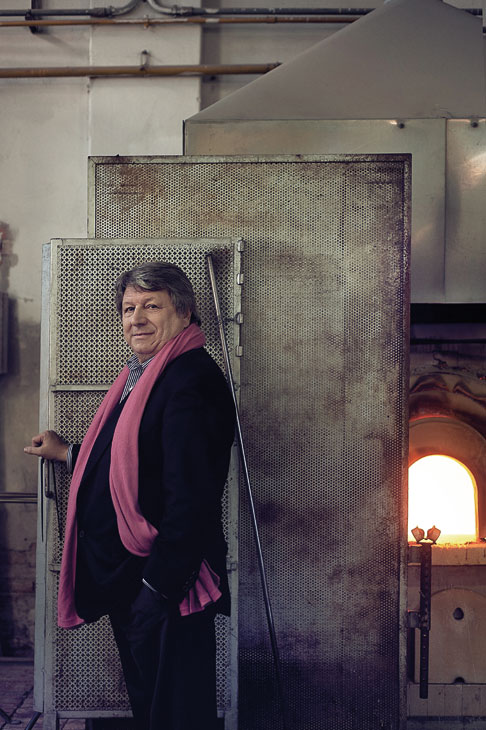 Adriano Berengo standing in front of a glass furnace at the Berengo Studio, Murano, Venice, 2011. Photo: Hugo Thomassen; courtesy Fondazione Berengo