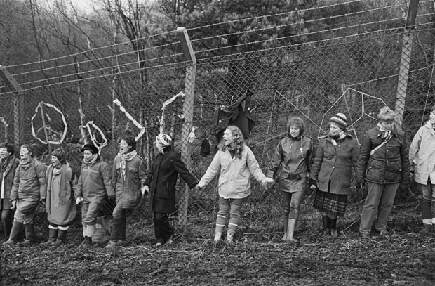 ‘Embrace the Base’: 30,000 women link hands, completely surrounding the nine mile perimeter fence at RAF/USAF Greenham Common, Berkshire (1982), Edward Barber