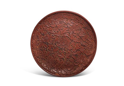 Carved cinnabar lacquer dish (Lat Yuan/early Ming dynasty), China. Sotheby's.