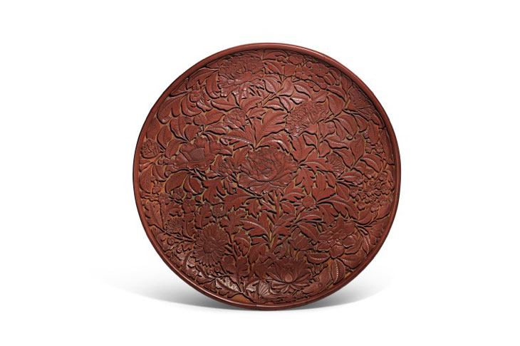 Carved cinnabar lacquer dish (Lat Yuan/early Ming dynasty), China. Sotheby's.