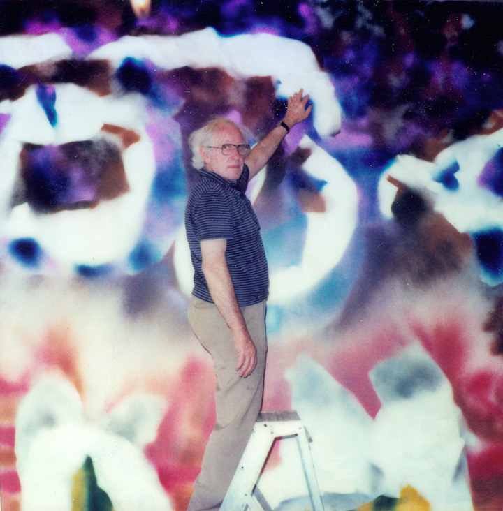 Sidney Nolan pictured with his work Abstract (1986). Courtesy of the Sidney Nolan Trust