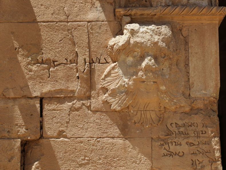 An Aramaic inscription next to this relief identifies it as a Gorgon. A video released by ISIS in 2015 features a militant attacking the piece with a sledgehammer. Damage can be seen to the top of the head and nose. Photo: AHMAD AL-RUBAYE/AFP/Getty Images.