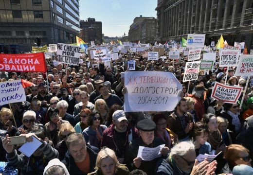 Demonstrators march during a protest in Moscow on 14 May, 2017, against the city's controversial plan to knock down Soviet-era apartment blocks and redevelop the old neighbourhoods. ALEXANDER NEMENOV/AFP/Getty Images