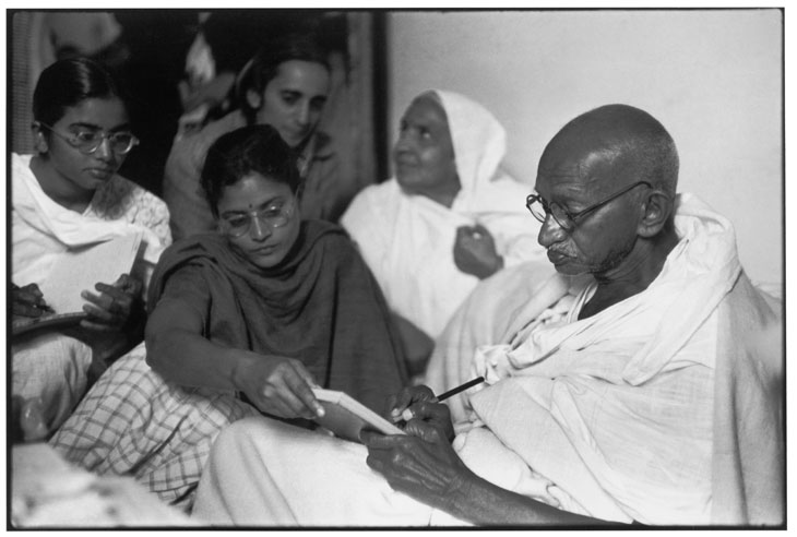 Gandhi dictates a message, just after breaking his fast Birla House, Delhi, India (1948), Henri Cartier-Bresson. © Henri Cartier-Bresson/Magnum Photos