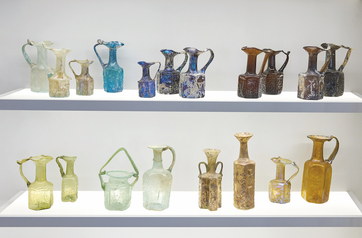 Glass and vessels on display in the Jay and Jeanie Schottenstein National Campus for the Archaeology of Israel, in a gallery focusing on the glass industry in Israel and the ancient world