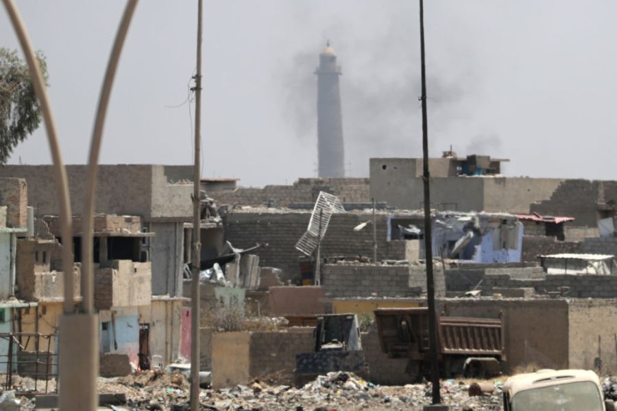 A general view shows smoke rising near the leaning Al-Hadba minaret in the Al-Nuri mosque compound, as Iraqi government forces advance in western Mosul's Zanjili neighbourhood on 7 June, 2017, during ongoing battles against Islamic State (IS) group fighters. Photo: KARIM SAHIB/AFP/Getty Images