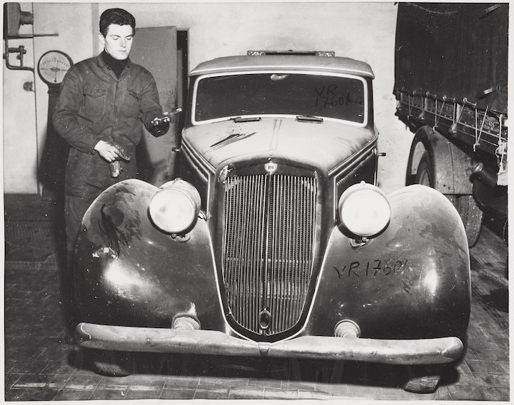 Benito Mussolini's dust covered motor car languishes in a Milan garage ten years after his death (1955), photographer unknown. Image courtesy of Whitechapel Gallery