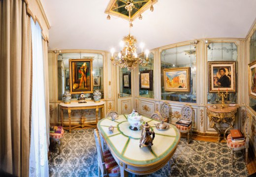 Paintings by De Chirico hang in the mirrored dining room of Francesco Federico Cerruti's villa. Photo: Gabriele Gaidano