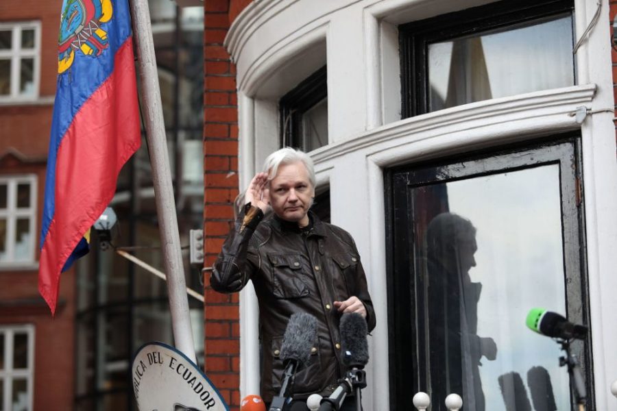 Julian Assange gestures as he speaks to the media from the balcony of the Embassy Of Ecuador on May 19, 2017 in London, England. Photo by Jack Taylor/Getty Images