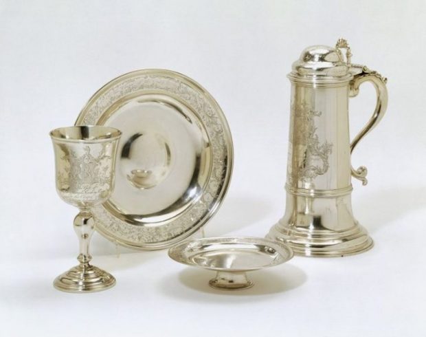 The silver cup, paten, flagon, alms dish for use in Holy Communion celebrated in the Chapel of the Asylum of the Female Orphans, Vauxhall, maker’s mark of Abraham Portal, London (1763-4), Victoria and Albert Museum