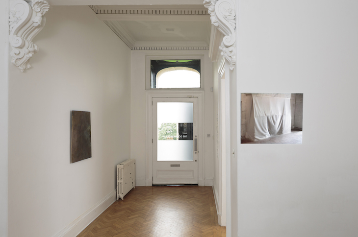 Installation view of 'Slow Objects' at the Common Guild, Glasgow, showing Vanessa Billy's Old Cloud (2017) and Edith Dekyndt's Slow Object 01 (1997)